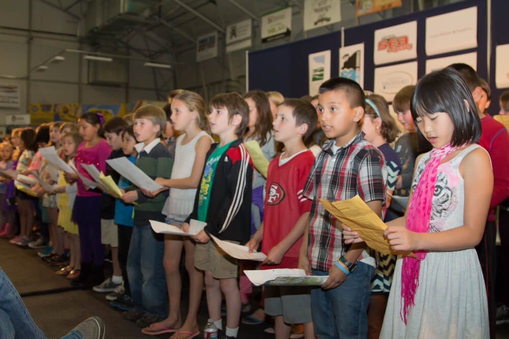 Children singing "This Land Is Your Land" at the Santa Cruz Redwoods National Monument Campaign Kick-off on 2/12/15 in Santa Cruz.