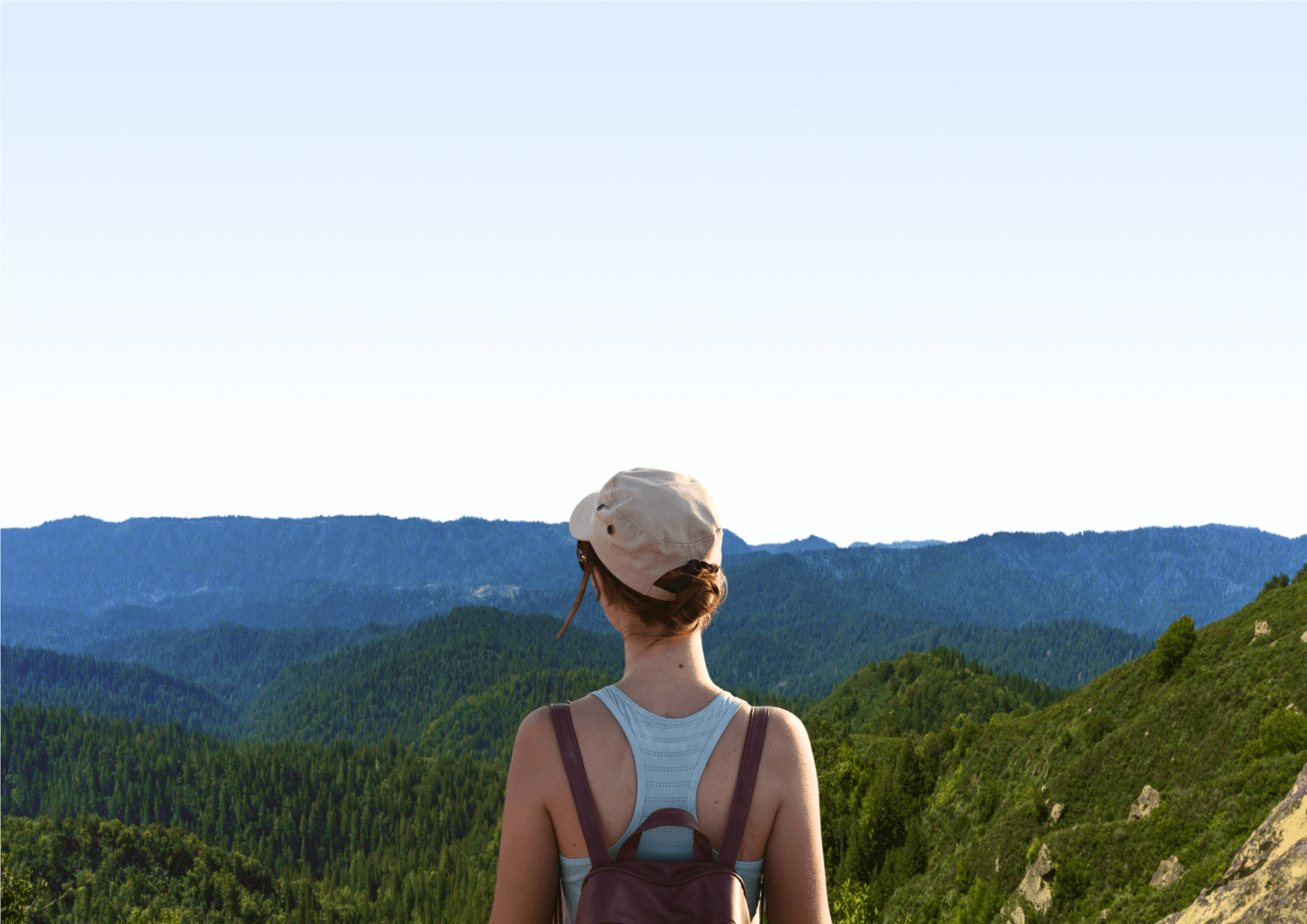 A hiker looks out over the Santa Cruz mountains.